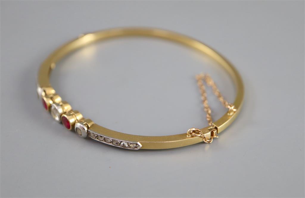 An Edwardian gold, ruby, old and rose cut diamond set hinged bracelet,